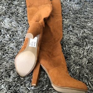 Camel trendy fall over the knee boots.